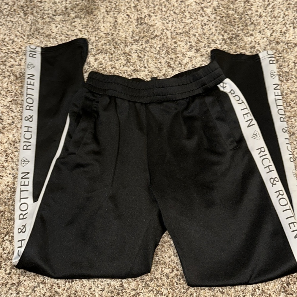 BLACK AND WHITE STRIPED RICH AND ROTTEN TRACK PANTS